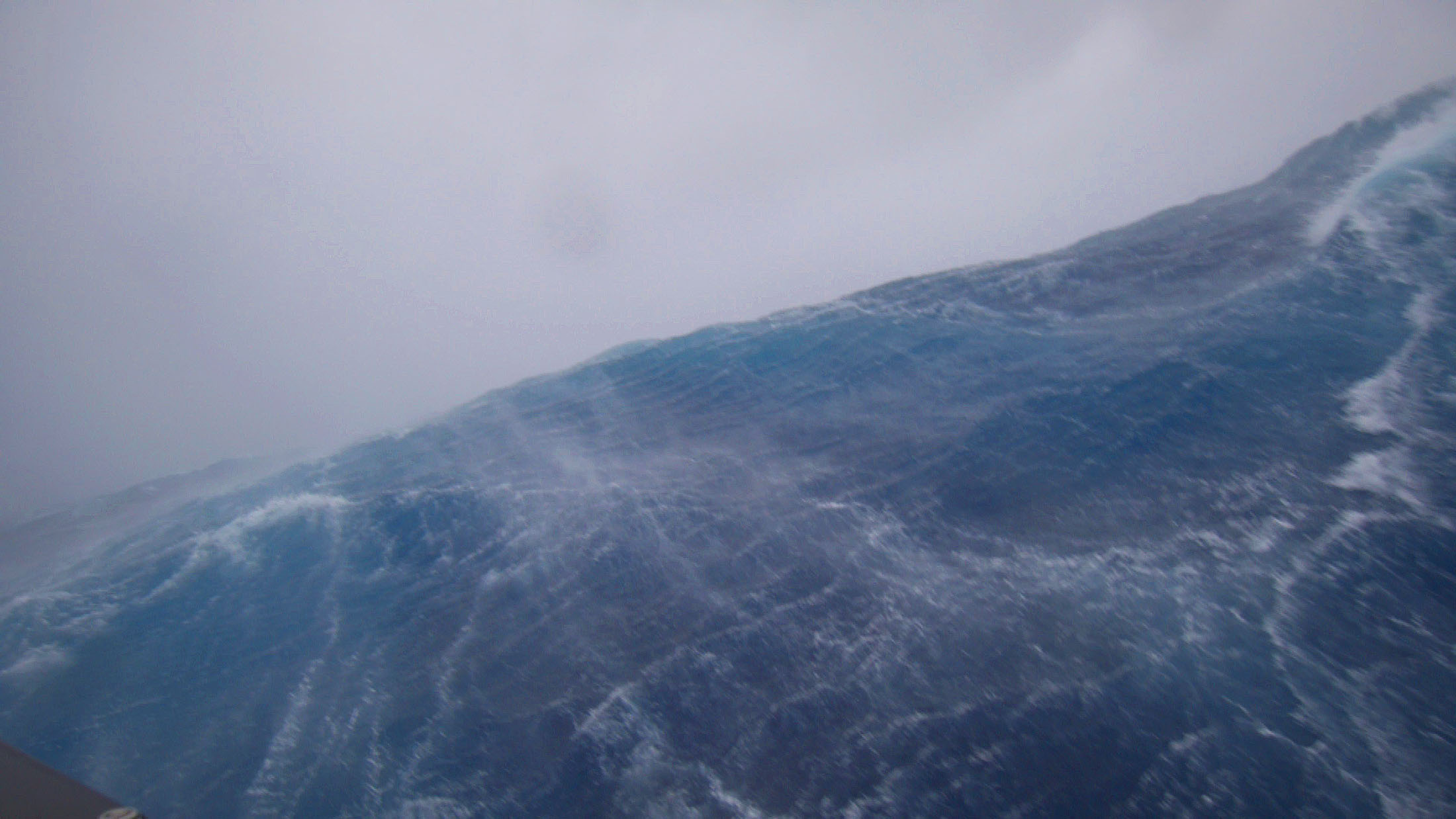 Towering storm waves seen from the deck of an uncrewed Saildrone inside Hurricane Sam.