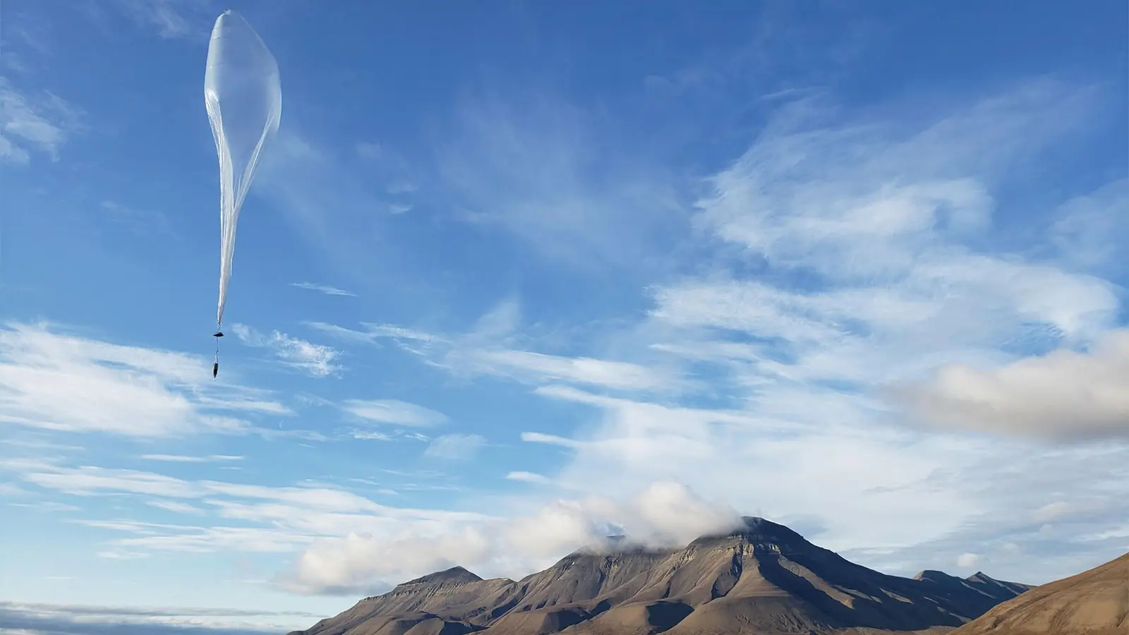 A long-duration WindBorne balloon aloft against the sky.