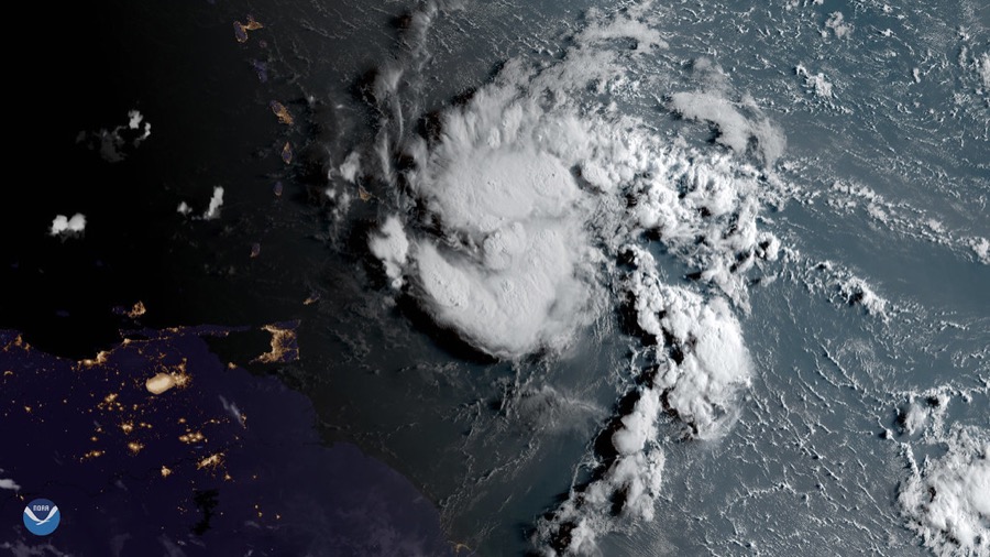 GOES-16 GeoColor satellite composite showing Tropical Storm Dorian’s white cloud circulation near the Lesser Antilles, with island nightlights overlaid.